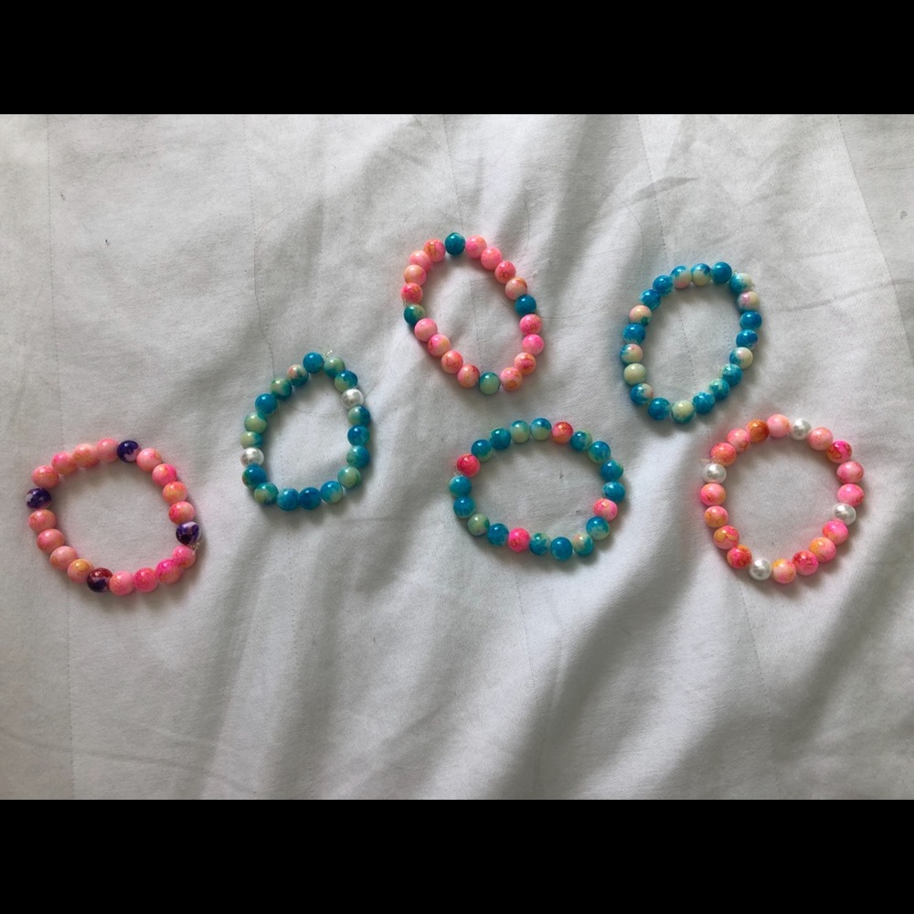 Homemade pink and blue anklets/ bracelets